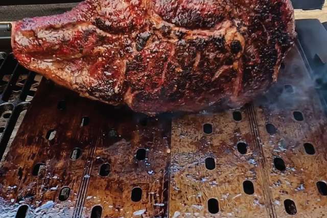 Grilling a steak on the Oklahoma Joe's HIghland Offset Smoker
